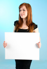 Naklejka premium Beautiful Redhead Lady Holding a Blank Sign