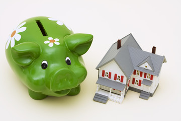 Home with piggy bank – he costs of a mortgage