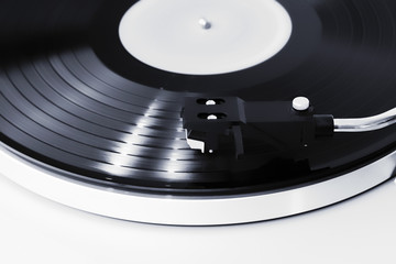 Vinyl player, focus on the needle, the record is spinning.