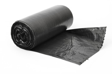 roll of black dustbin liners isolated on white background