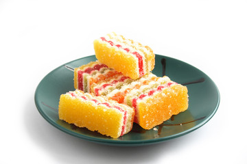 On a photo a piece of colored fruit candy