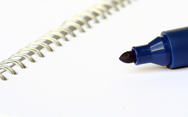 blue marker on white notebook - 6491075