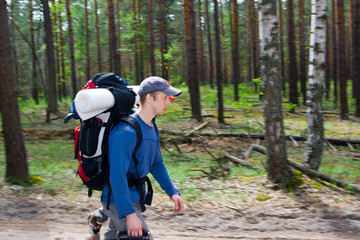 Obraz premium Tourist walking on the road at wood.
