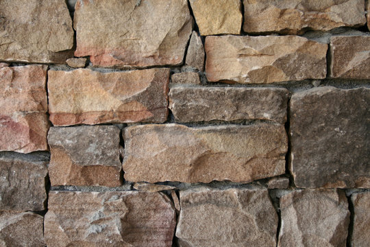 Bricks and stones make up a landscaping wall