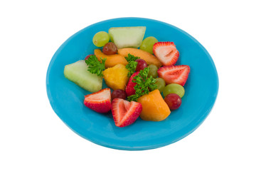 fresh fruit salad on blue plate