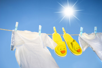 White t-shirts and slippers on the clothesline