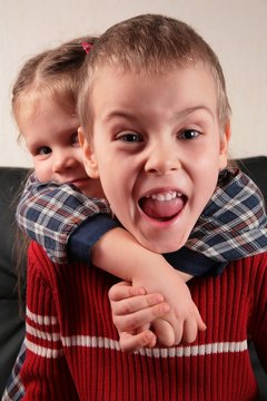 Girl Embraces Boy For The Neck, Aggressive Defence Boy