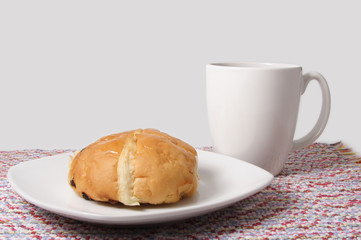 hot cross bun and coffee