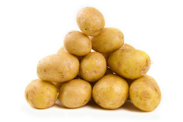Pile of potatoes isolated on white