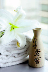Chinese pottery, white lily and towels, China