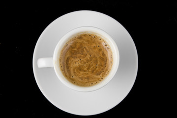 Cup of coffee on black