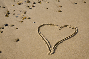  Drawing of a heart on sandy beach