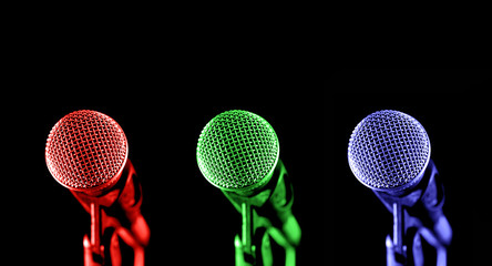 primary colored microphones on black - 6549081