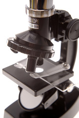 Microscope over white background