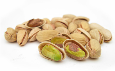 Pistachio nuts isolated on white background