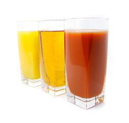 orange apple and grape juice in glass