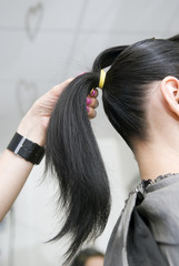 Fototapeta premium Comb one's black hair