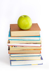 books  and green apple