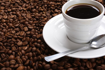 Cup with coffee, costing on coffee grain