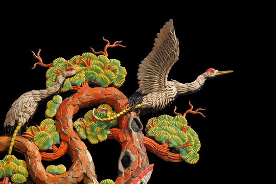 Asian temple crane motif on black background