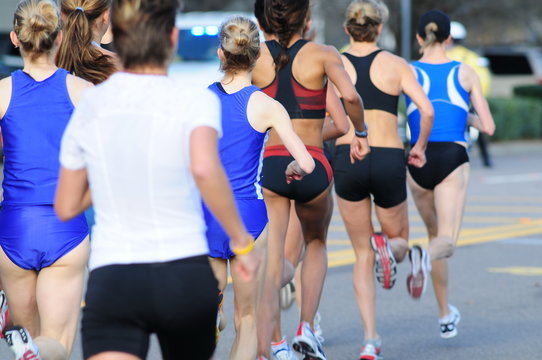fit female runners take off