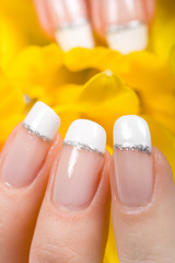 Fingers protecting tulips