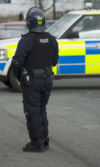 Uk Police Officer in Riot Gear
