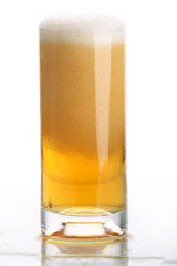 Glass of beer close-up with froth