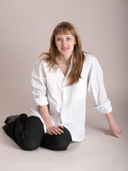 Nice girl sitting in studio