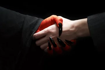 Fotobehang Handshake with Devil © MaksymFilipchuk