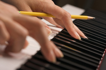 Woman's Fingers on Digital Piano Keys