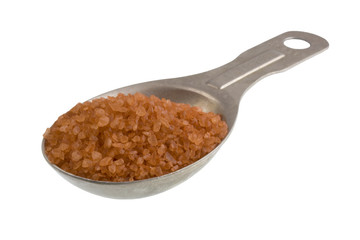 tablespoon of alaea (traditional Hawaiian) sea salt isolated on