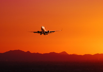 Plane taking off at sunset, Arizona