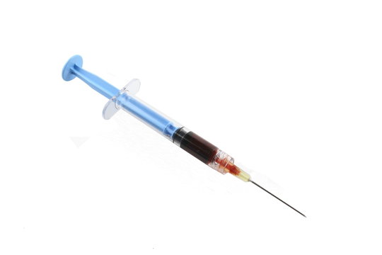 Filled Blue Syringe With Needle