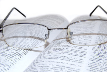 Glasses on the book