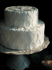 Elaborate White Wedding Cake on Cake Stand