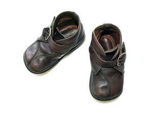 Child's old boots isolated over a white background