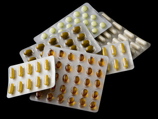 Vitamin Pills isolated on black