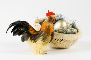 Cock and eggs in a nest