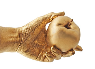 gold hand and apple