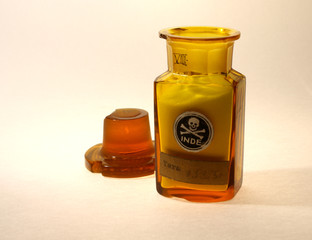 Ancient glass pharmaceutical phial with toxic substance