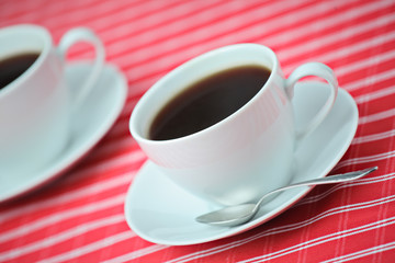 Two coffee cups on a table