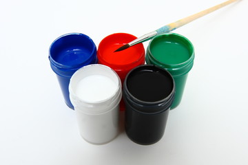Brush and many paint jars with gouache 