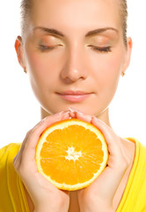 Beautiful girl with juicy orange