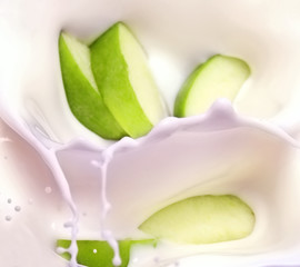 green apple slices and milk splash