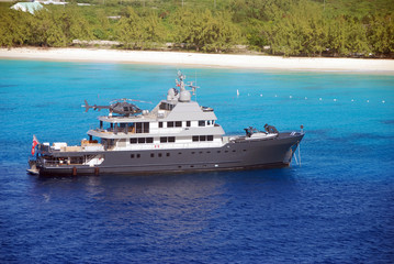 Luxury yacht visiting Caribbean island