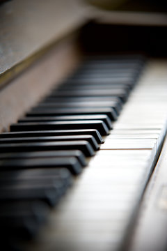 Old piano keyboard close-up