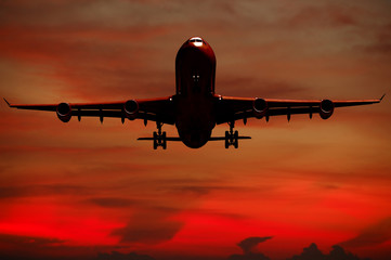 Air travel - Silhouett of plane and sunset