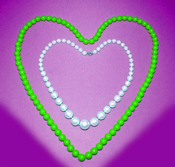 The Necklace on violet background.