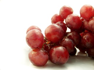 Wet Red Grapes on White